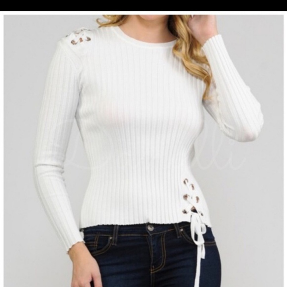 Lovely white sweater.. lace up s